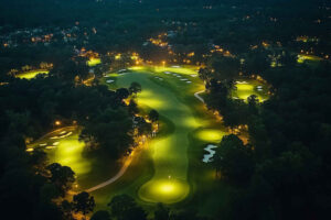 A_professional_nighttime_aerial_view_of_a_golf_course