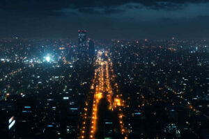A_city_skyline_at_night_with_street_lights_equipped_with_smart_control