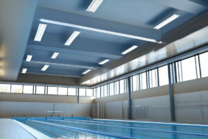 LED_high_bay_lights_installed_above_an_indoor_swimm_pool